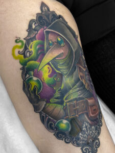 Plague Doctor from "Darkest Dungeon" tattoo in neotraditional style by Meow Ink Alex Lukasiewicz in Den Haag